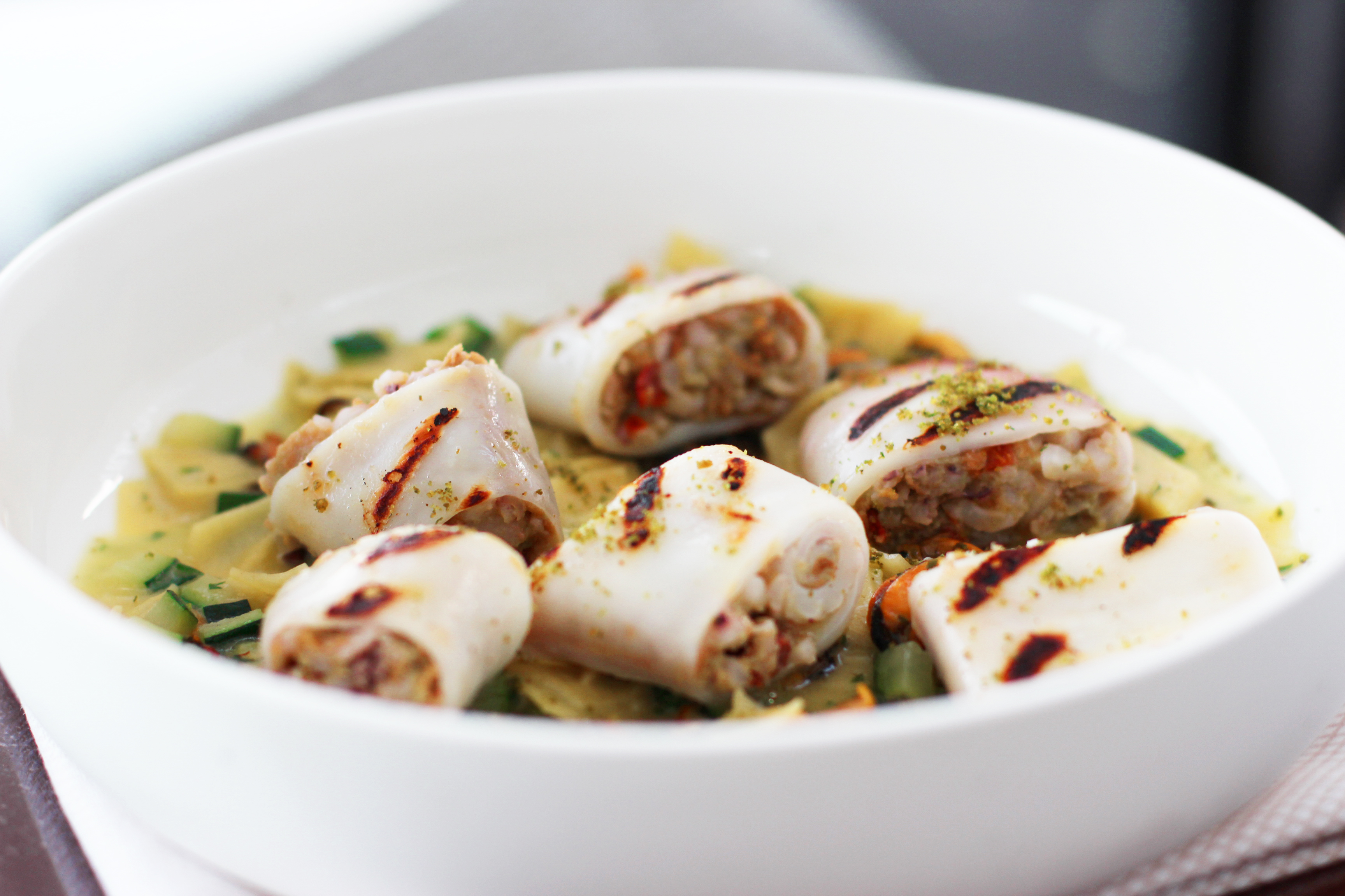 Stuffed squid garnished with pasta 